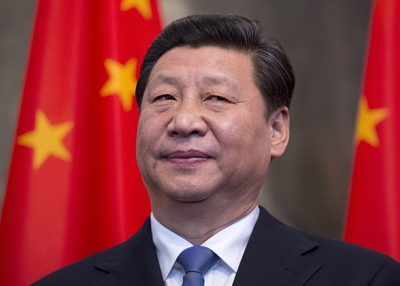 Chinese President Xi Jinping stands by national flags in Berlin on March 28, 2014. (Johannes Eisele/AFP/Getty)