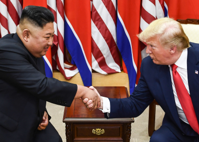 Picture of President Trump and Leader Kim Shaking Hands