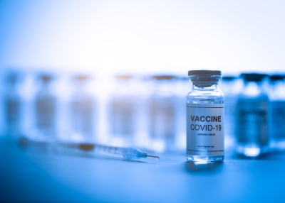 Vials with covid-19 coronavirus vaccine on laboratory table ready to be distributed for prevention of infection with this virus