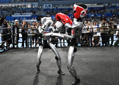 Robots compete in a boxing event during the World Humanoid Robots Games in Beijing on August 17, 2025.