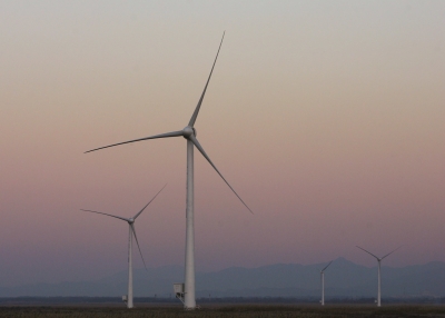 A wind turbine is seen at sunset on the south bank of Guanting Reservoir on December 13, 2007 in Beijing, China. The Guanting Wind Power Field is the first wind power plant in Beijing. (Feng Li/Getty Images)